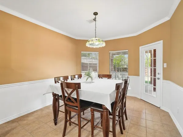 a view of a dining room with furniture window and outside view