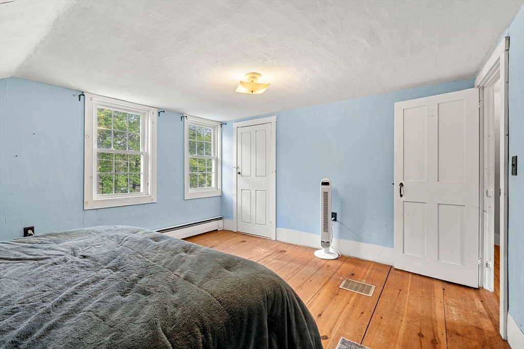 600 Main Street Ashby, MA 01431 - Photo 24 of 40 a bedroom with a bed and a window