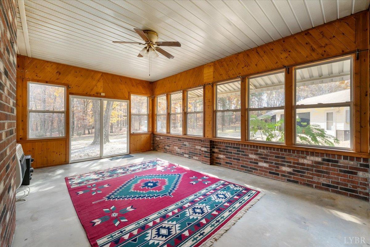 391 Pond Road Buckingham, VA 23921 - Photo 18 of 75 a living room with a large bed and a large window