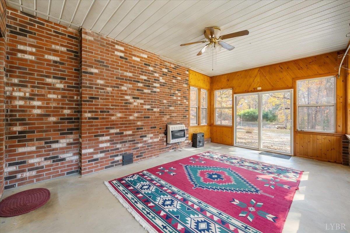 391 Pond Road Buckingham, VA 23921 - Photo 19 of 75 a view of an empty room with a ceiling fan and a window