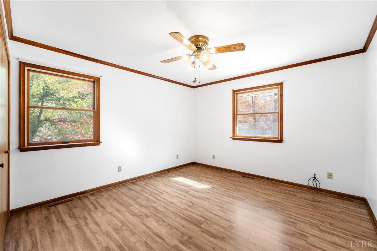 391 Pond Road Buckingham, VA 23921 - Photo 26 of 75 wooden floor in an empty room with a window