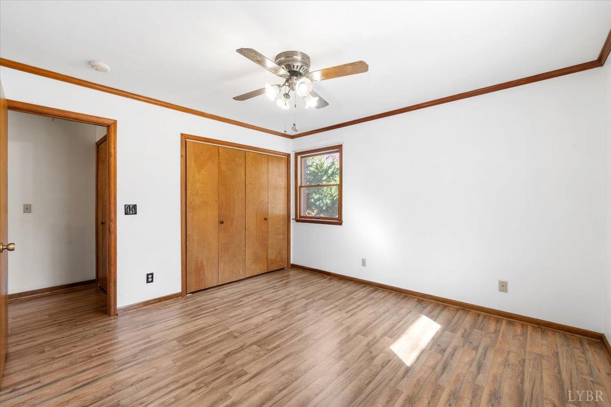391 Pond Road Buckingham, VA 23921 - Photo 27 of 75 a view of an empty room with wooden floor and a window