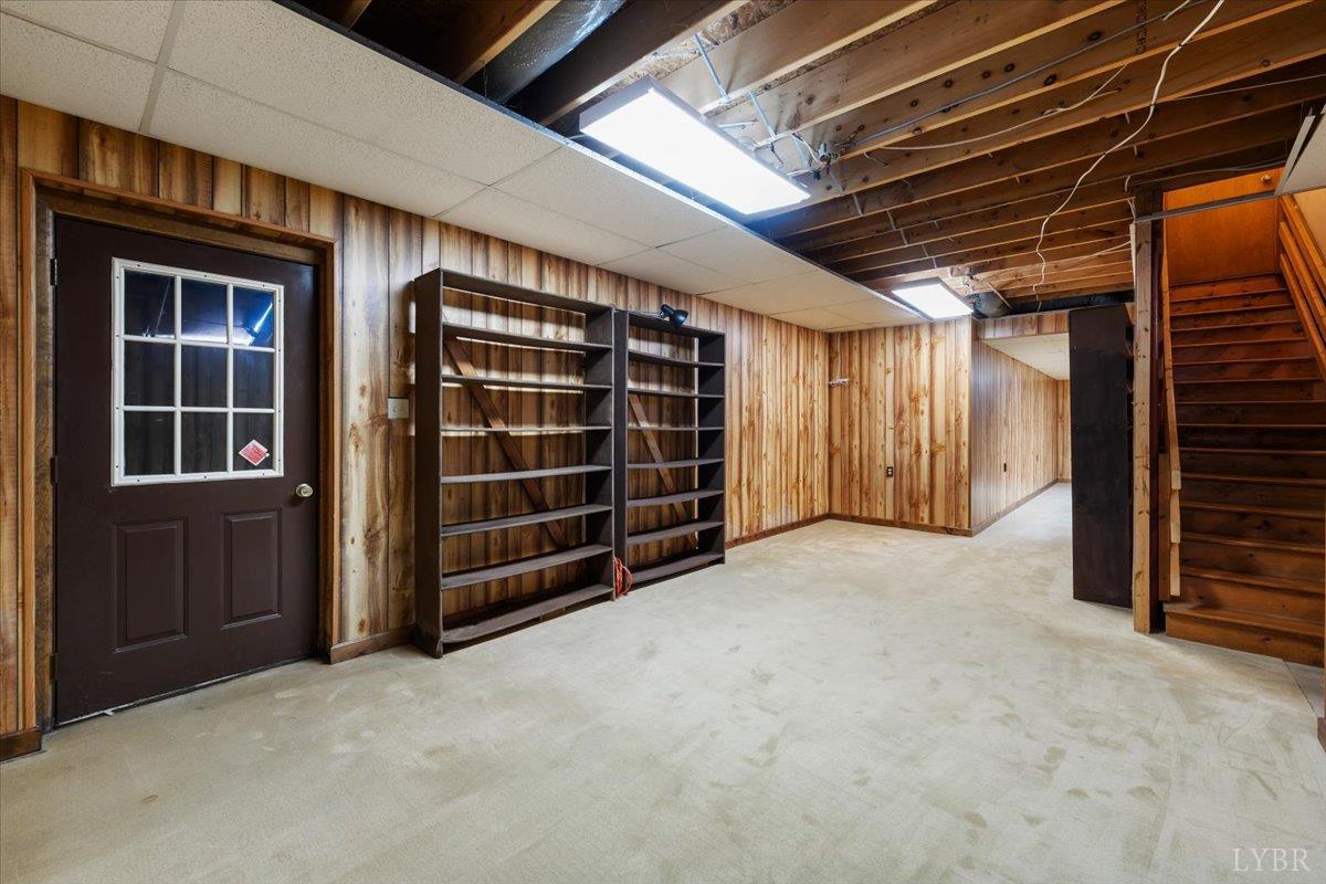 391 Pond Road Buckingham, VA 23921 - Photo 32 of 75 a view of an empty room with furniture and a window