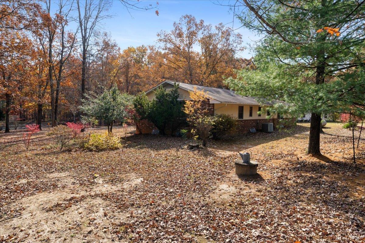 391 Pond Road Buckingham, VA 23921 - Photo 52 of 75 a backyard of a house with table and chairs