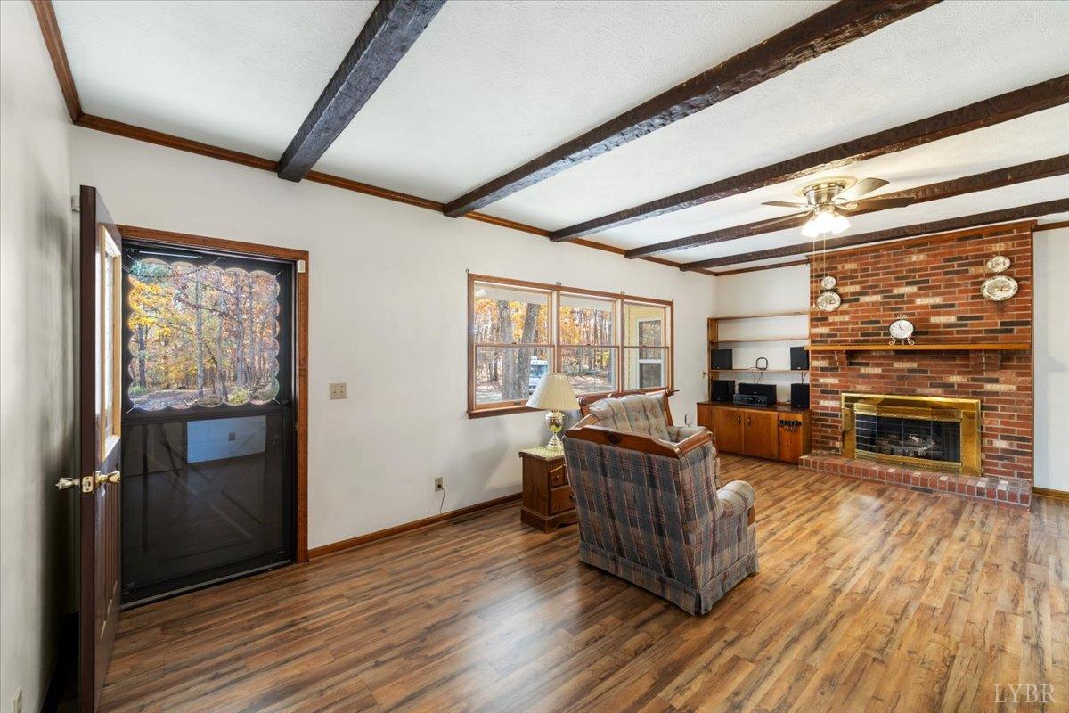 391 Pond Road Buckingham, VA 23921 - Photo 6 of 75 a living room with furniture and a fireplace