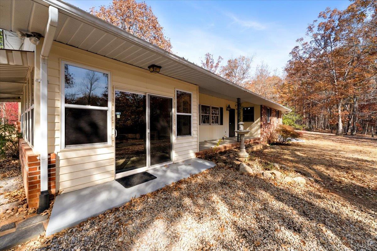 391 Pond Road Buckingham, VA 23921 - Photo 66 of 75 a view of a house with a large window and wooden fence