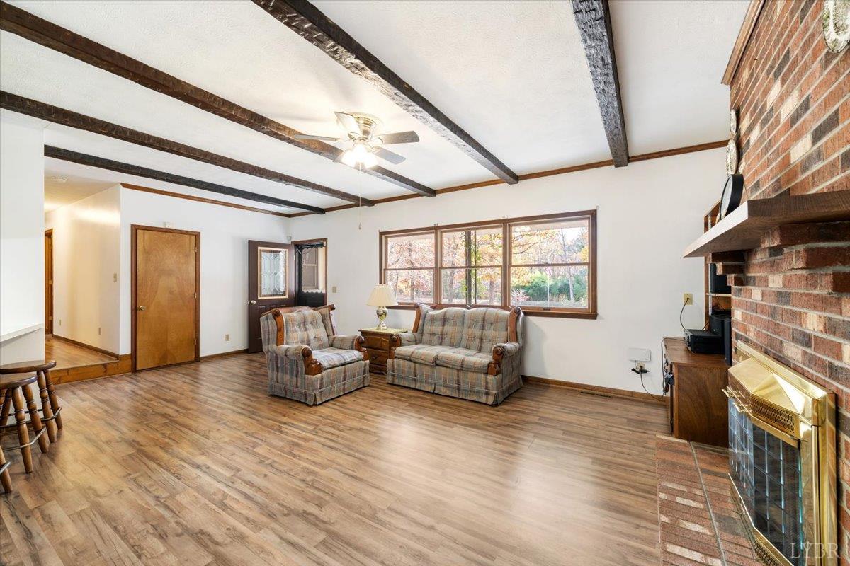 391 Pond Road Buckingham, VA 23921 - Photo 9 of 75 a living room with furniture and a fireplace