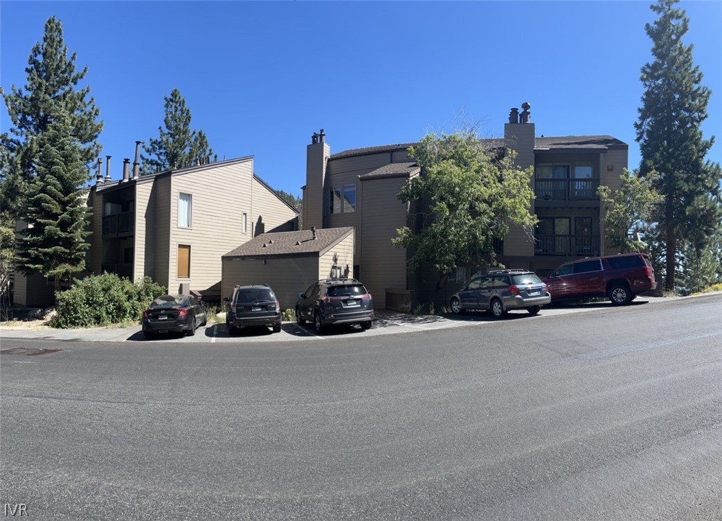 115 Tramway Drive, Unit 2 Stateline, NV 89449 - Photo 16 of 18 front view of a house with a yard and a car parked on the road