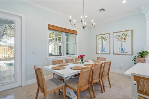 a view of a dining room with furniture window and chandelier