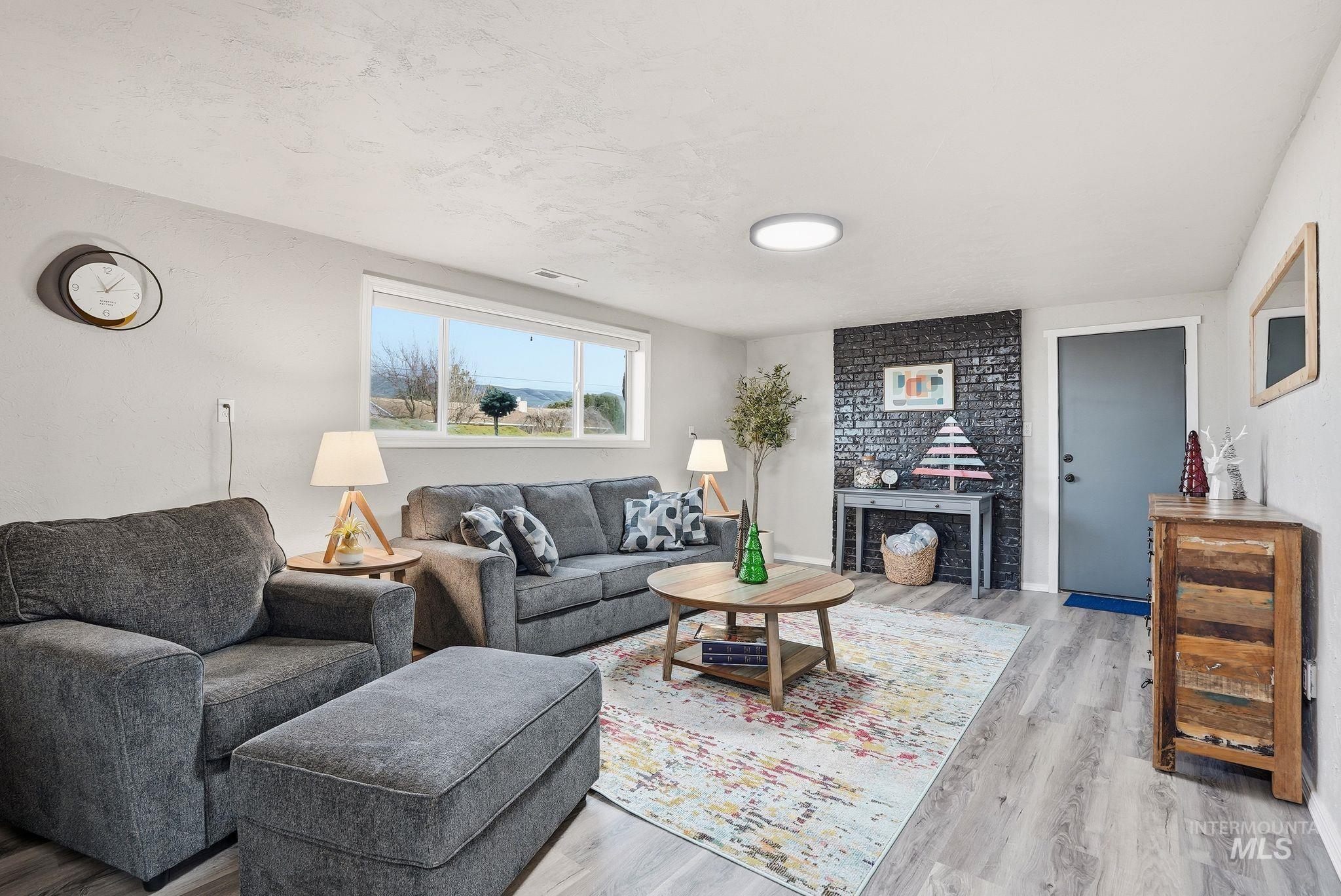 2435 Easy Street Clarkston, WA 99403 - Photo 25 of 49 Living area featuring light wood finished floors and a textured ceiling