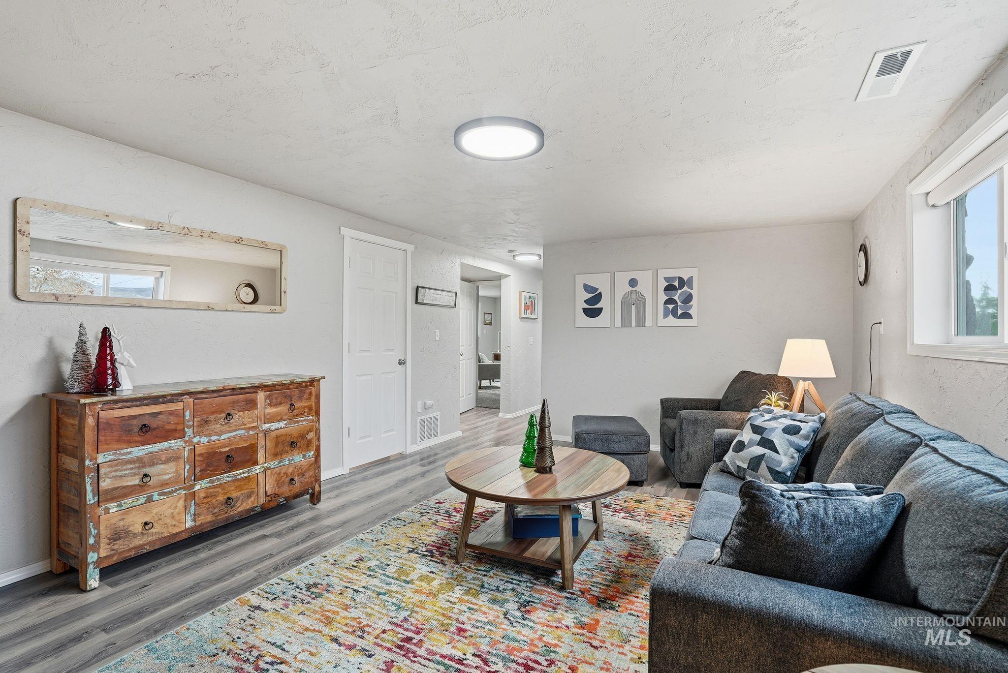 2435 Easy Street Clarkston, WA 99403 - Photo 27 of 49 Living area with wood finished floors and a textured ceiling