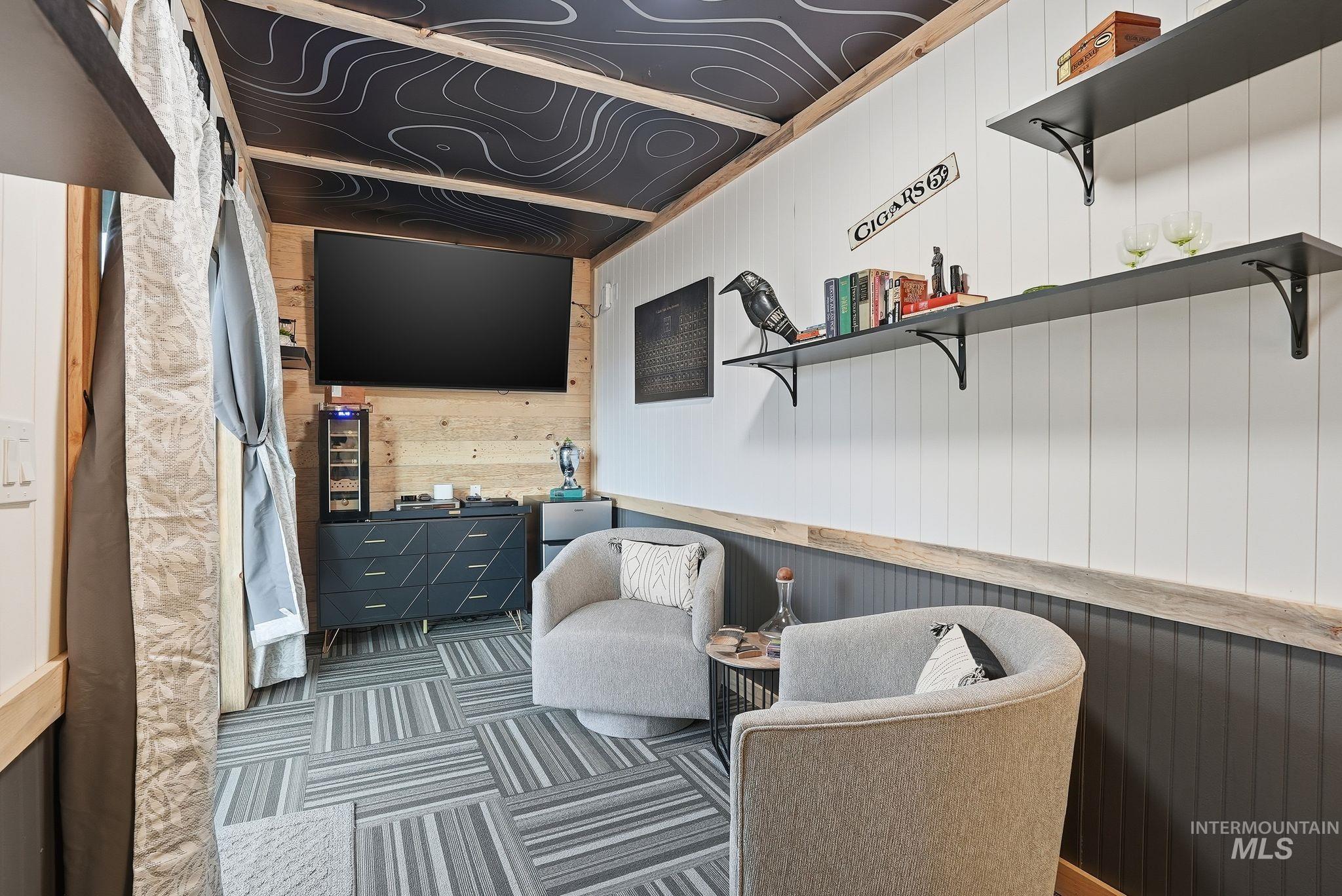 2435 Easy Street Clarkston, WA 99403 - Photo 30 of 49 Living area with wooden walls and carpet flooring