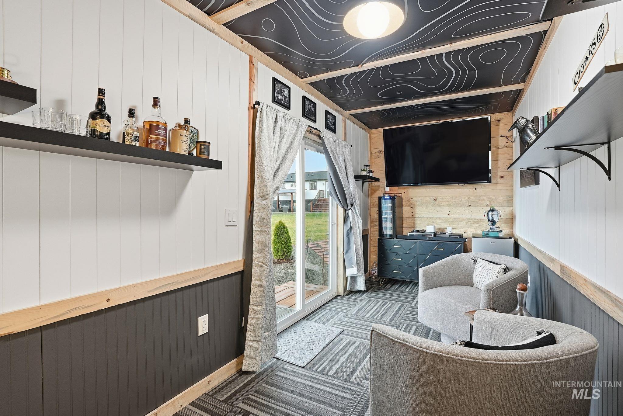 2435 Easy Street Clarkston, WA 99403 - Photo 31 of 49 Living room with wood walls and carpet flooring