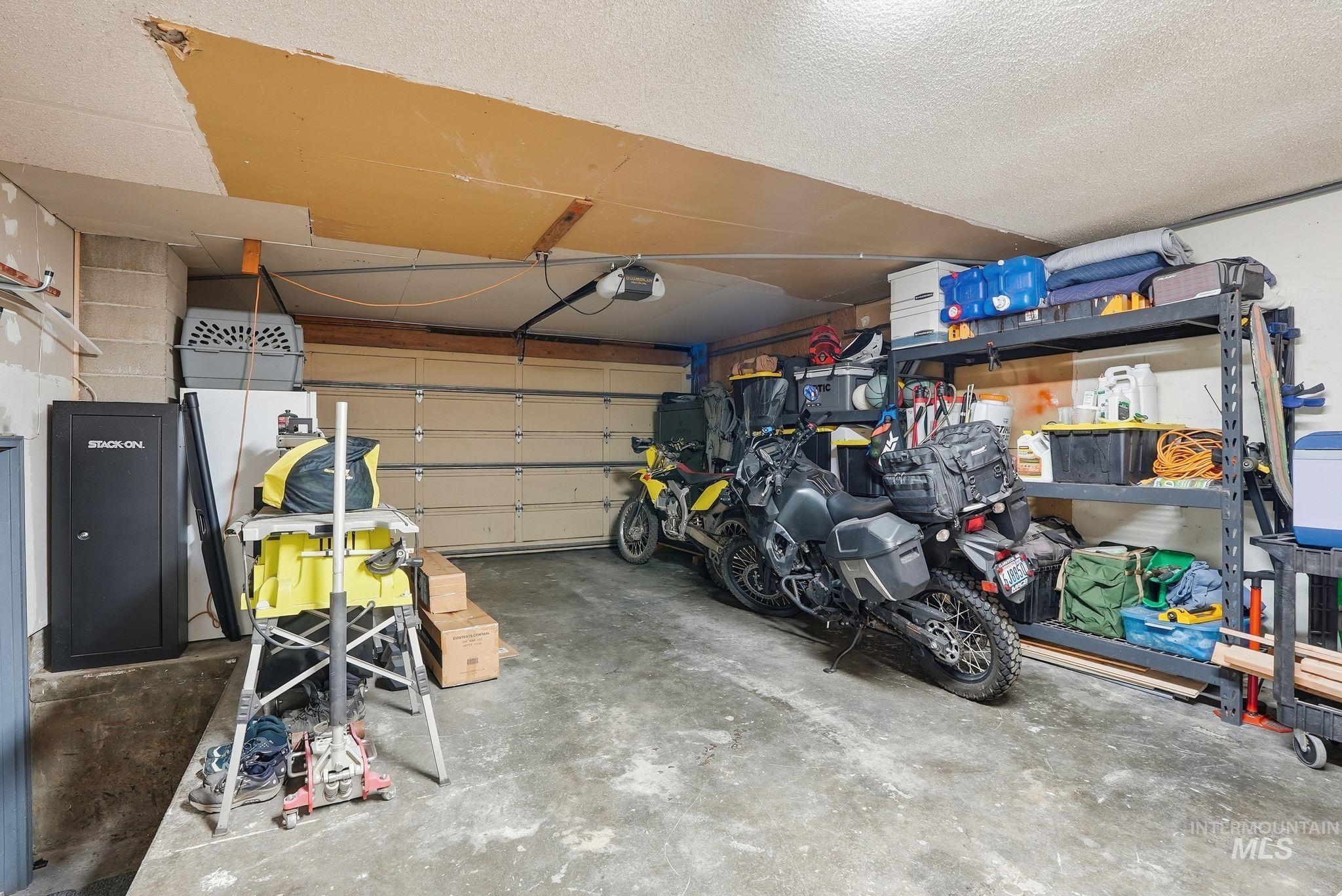 2435 Easy Street Clarkston, WA 99403 - Photo 35 of 49 Garage featuring a garage door opener