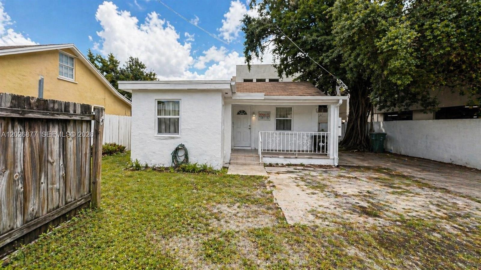 2727 Southwest 24th Street Miami, FL 33145 - Photo 10 of 18 a view of a house with backyard and a tree
