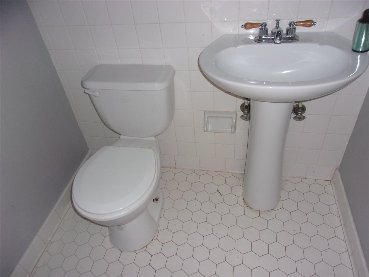 4440 Yale Road Memphis, TN 38128 - Photo 16 of 24 a bathroom with a toilet and a sink