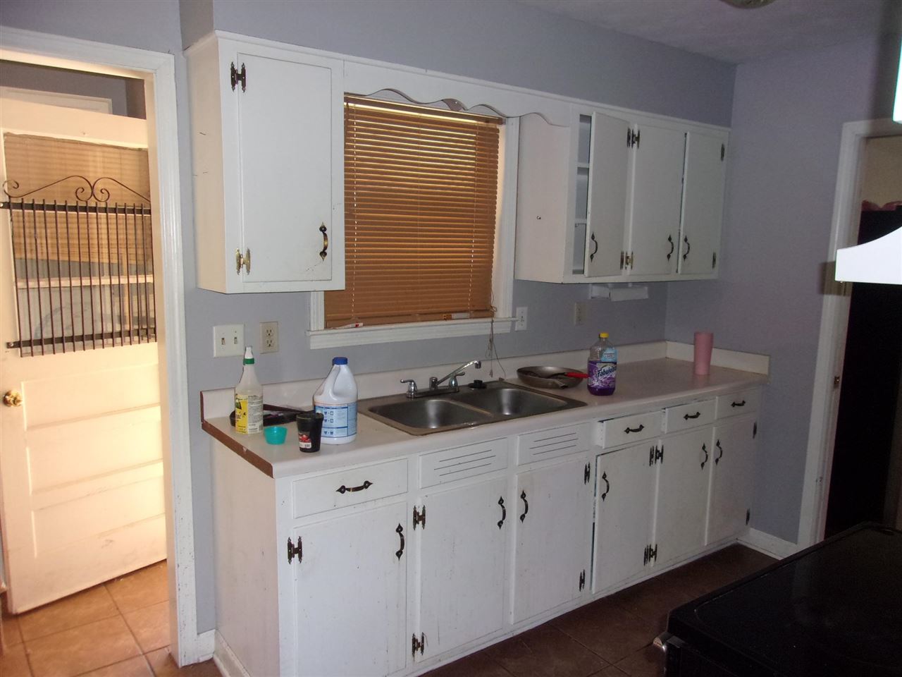 4440 Yale Road Memphis, TN 38128 - Photo 6 of 24 a kitchen with white cabinets and sink