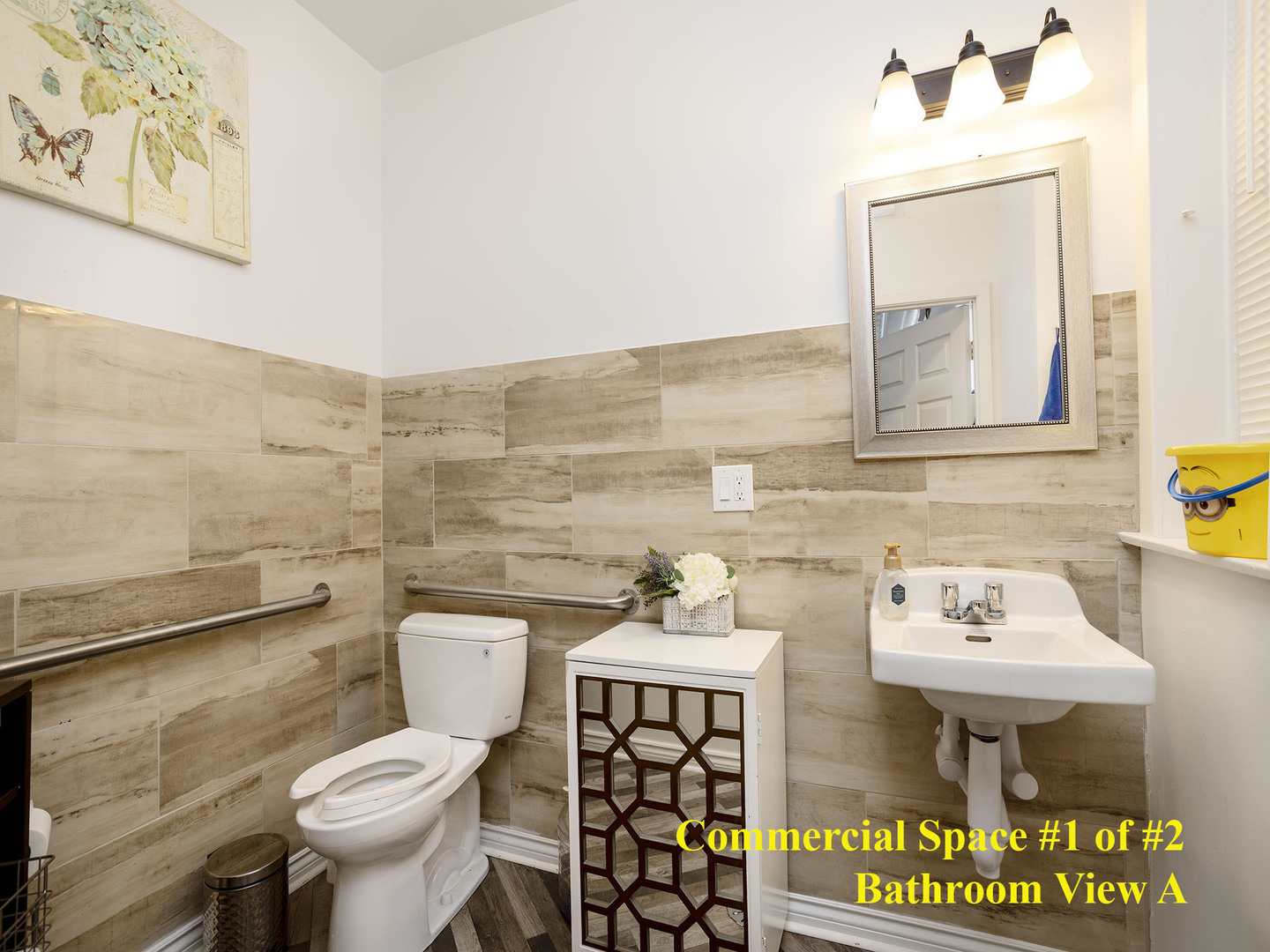 7929 Ogden Avenue Lyons, IL 60534 - Photo 11 of 44 a bathroom with a sink a toilet and a mirror