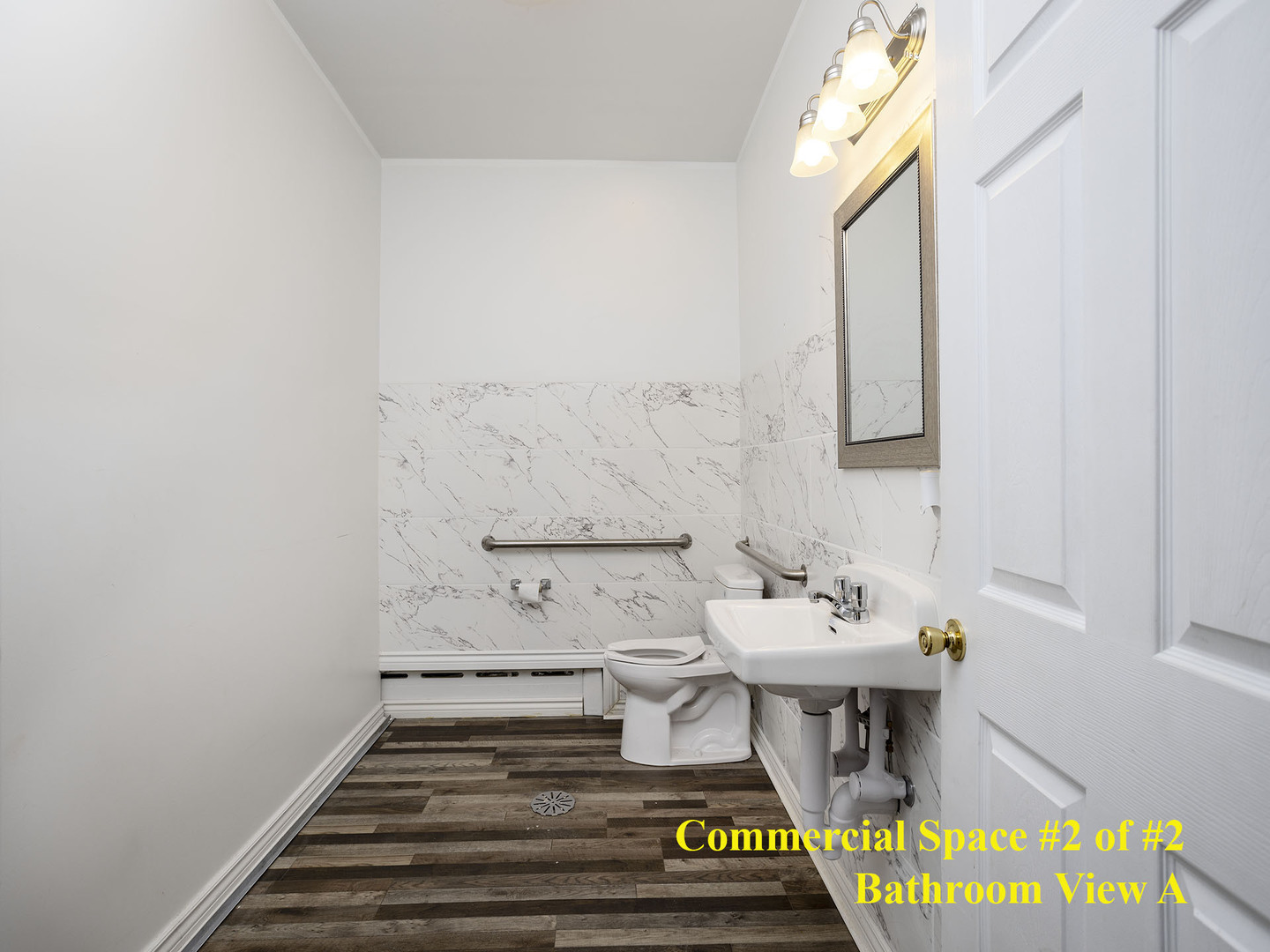 7929 Ogden Avenue Lyons, IL 60534 - Photo 17 of 44 a bathroom with a sink and a mirror