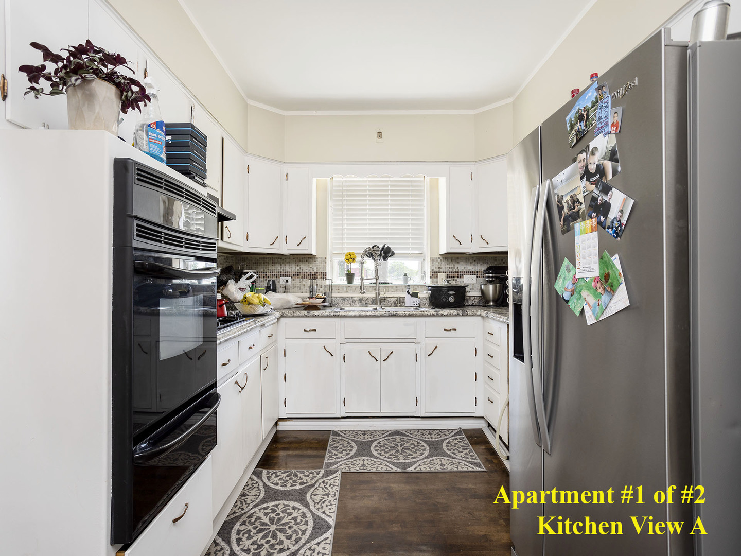 7929 Ogden Avenue Lyons, IL 60534 - Photo 22 of 44 a kitchen with stainless steel appliances granite countertop a refrigerator and a stove top oven