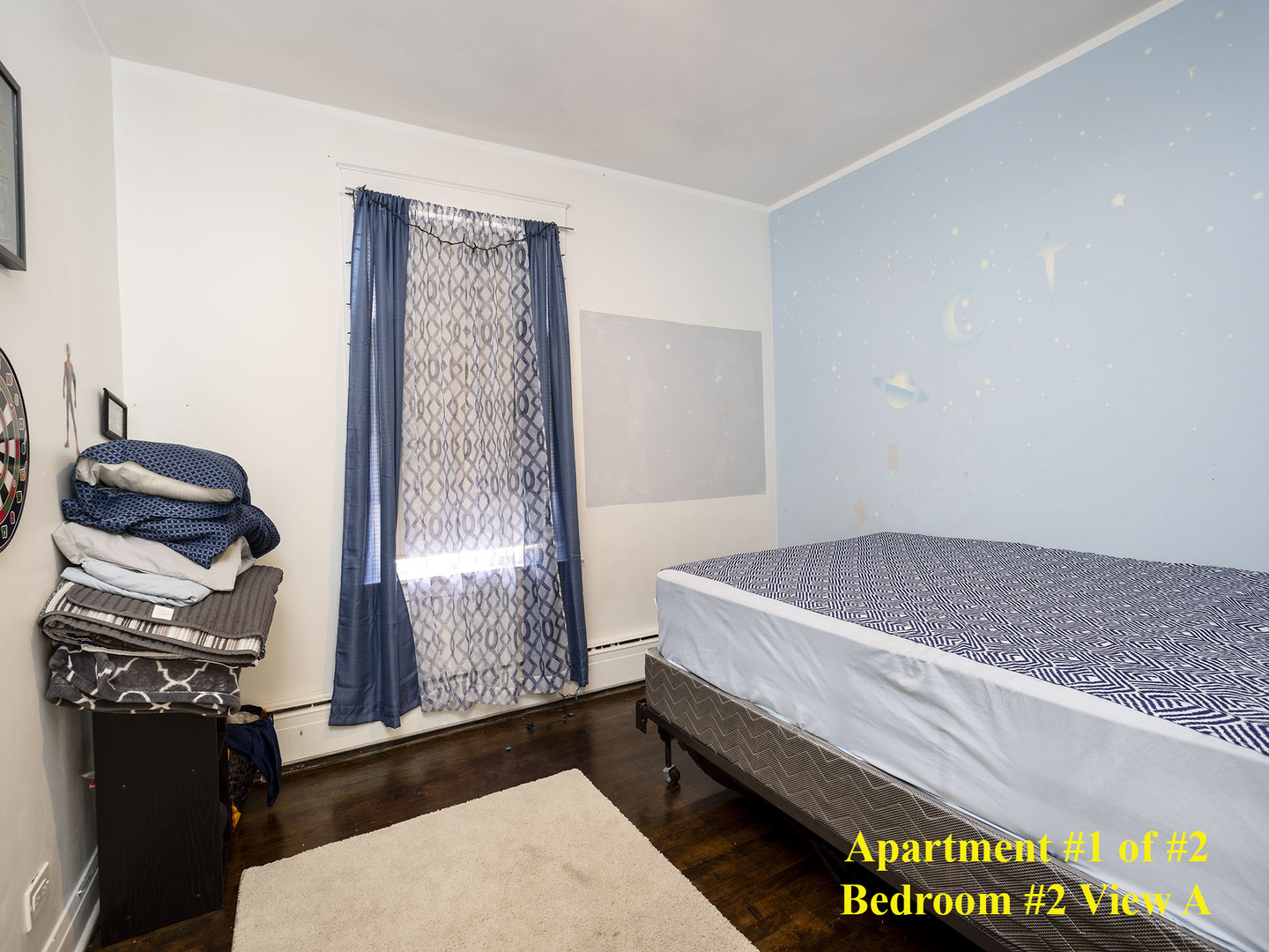 7929 Ogden Avenue Lyons, IL 60534 - Photo 25 of 44 a bedroom with a bed and a chandelier