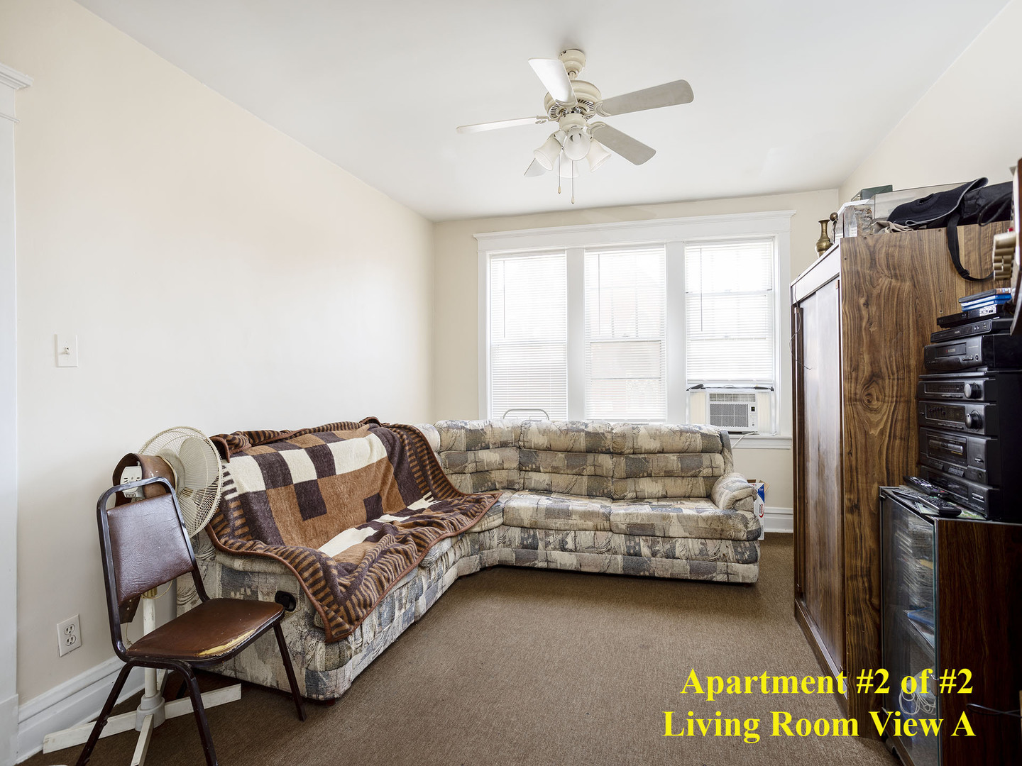 7929 Ogden Avenue Lyons, IL 60534 - Photo 32 of 44 a bedroom with a bed and a chandelier