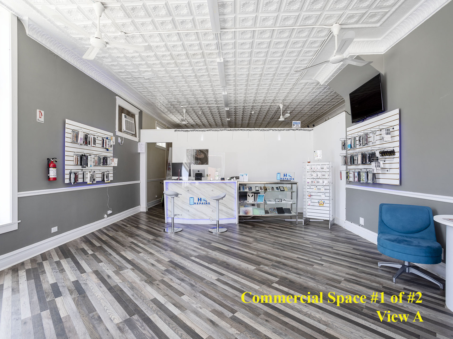 7929 Ogden Avenue Lyons, IL 60534 - Photo 7 of 44 a living room with furniture and a flat screen tv