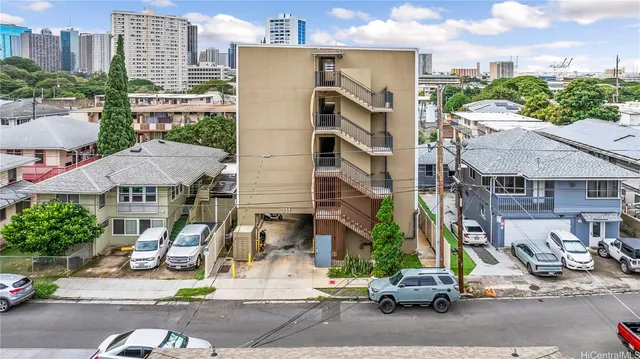 a view of multiple houses with a street