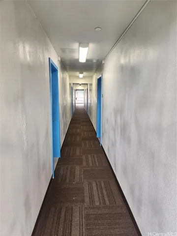 a view of gallery with wooden floor