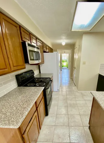 a kitchen with a stove and a sink