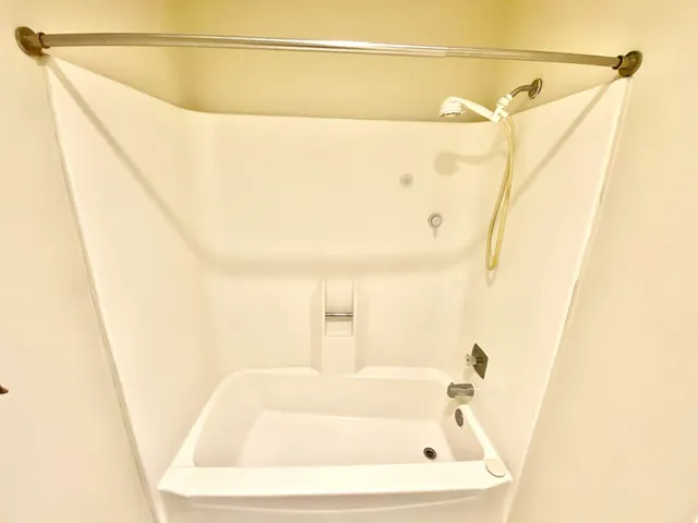 a bathroom with a white bath tub