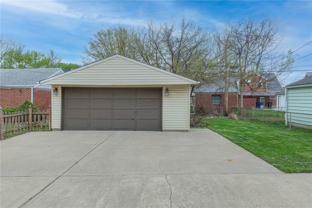 1012 Hampshire Road Dayton, OH 45419 - Photo 36 of 39 This property features a functional garage and a spacious concrete driveway, ideal for convenient parking.