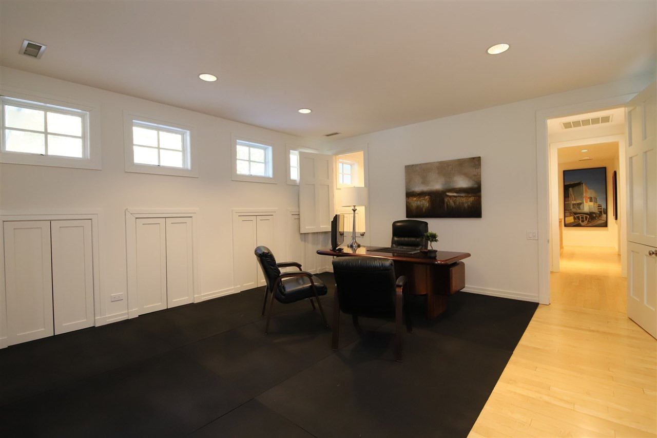6605 Greywalls Lane Raleigh, NC 27614 - Photo 22 of 30 Under eave storage lines both sides of the room. Office