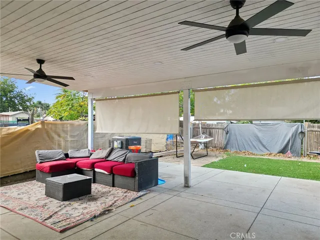 a sitting area with furniture and a yard