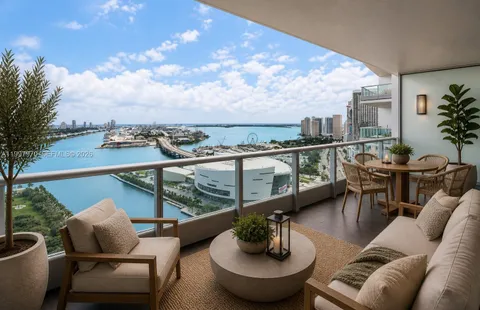 a view of a balcony with couches and wooden floor