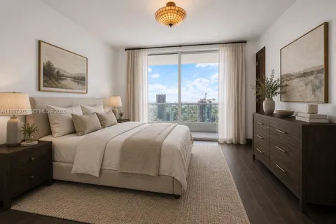 a bedroom with bed and window