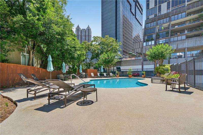 a view of a patio with a table and chairs