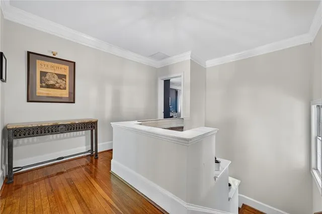 a view of storage and utility room with wooden floor