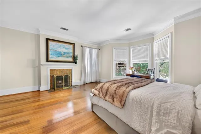 a bedroom with a bed and a fireplace