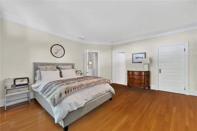 a bedroom with a bed and a table