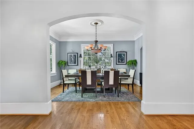 a view of a dining room with furniture and wooden floor