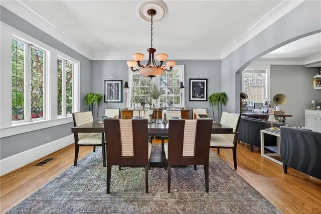 a view of a dining room with furniture window and wooden floor