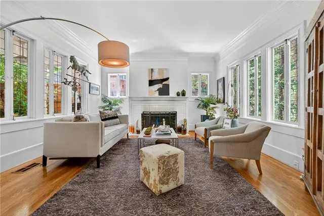 a living room with furniture and a fireplace