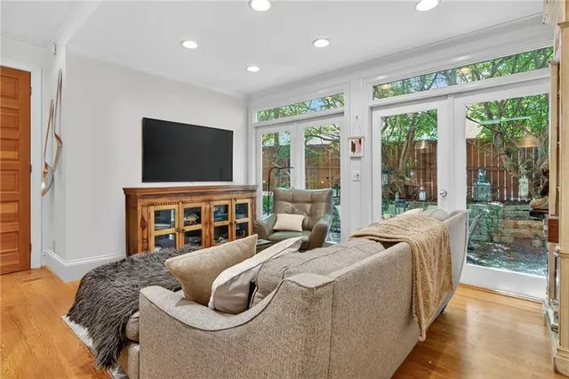 a bedroom with furniture and a flat screen tv
