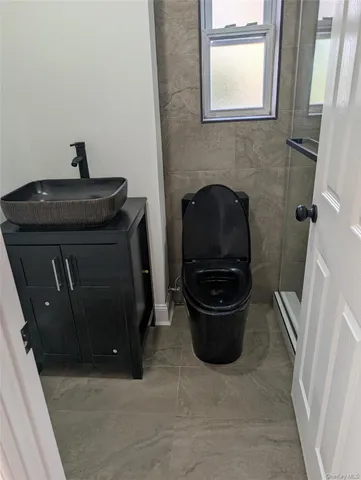 a kitchen with a sink and a stove top oven