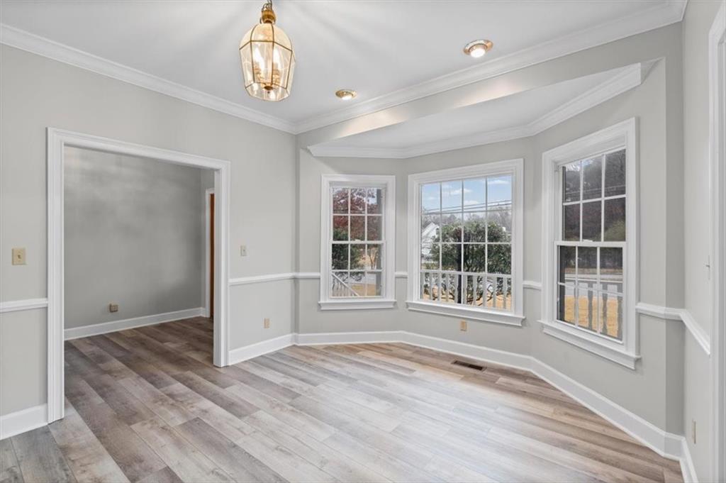 4003 Garden Lakes Parkway Rome, GA 30165 - Photo 12 of 20 an empty room with wooden floor and windows
