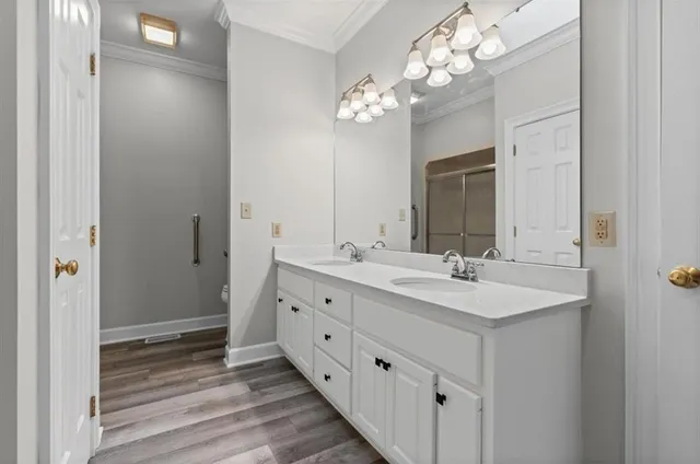 a bathroom with a double vanity sink and a mirror