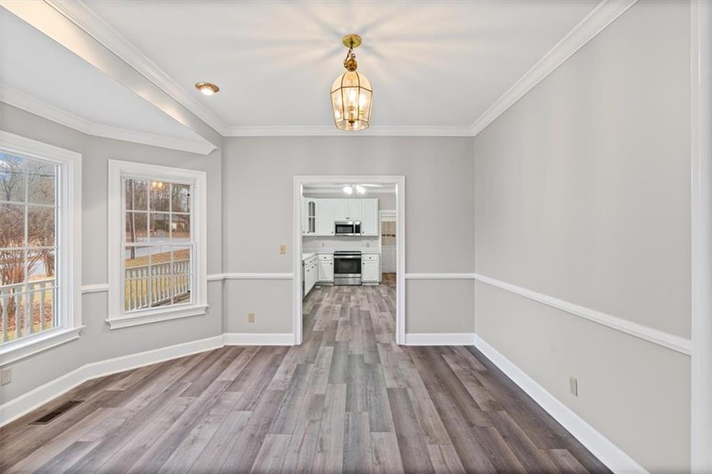 4003 Garden Lakes Parkway Rome, GA 30165 - Photo 13 of 20 a view of empty room with wooden floor and window