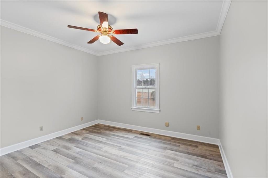 4003 Garden Lakes Parkway Rome, GA 30165 - Photo 16 of 20 wooden floor in an empty room with a window