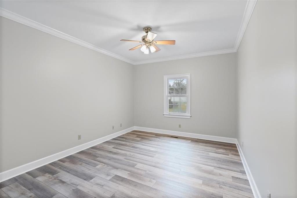 4003 Garden Lakes Parkway Rome, GA 30165 - Photo 18 of 20 wooden floor in an empty room with a window